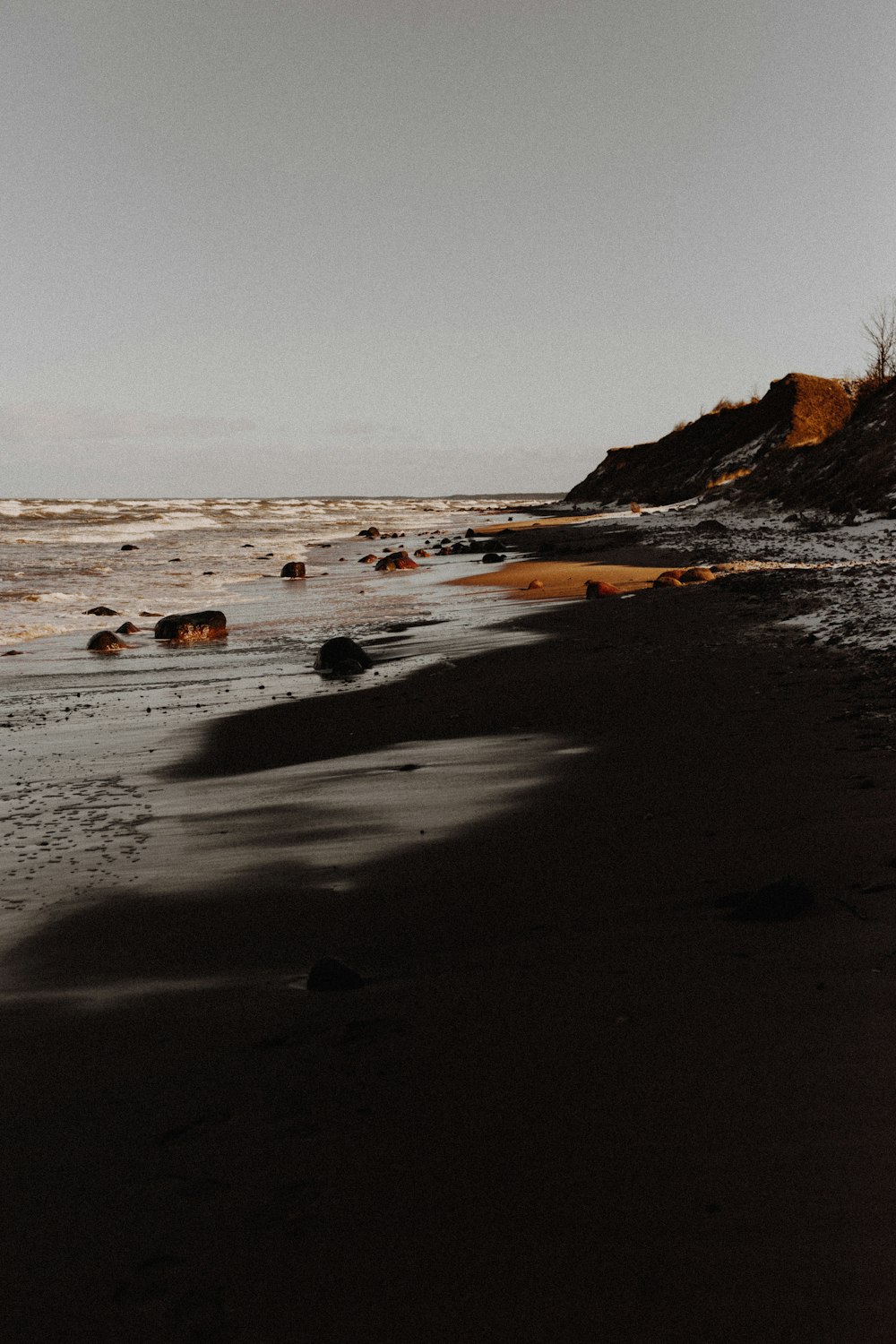 brown rock formation on sea shore during daytime