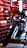 A sleek and glossy motorcycle is prominently displayed against a backdrop of red brick walls. The scene is enhanced with industrial lighting, creating intriguing reflections and highlights on the motorcycle's surface.
