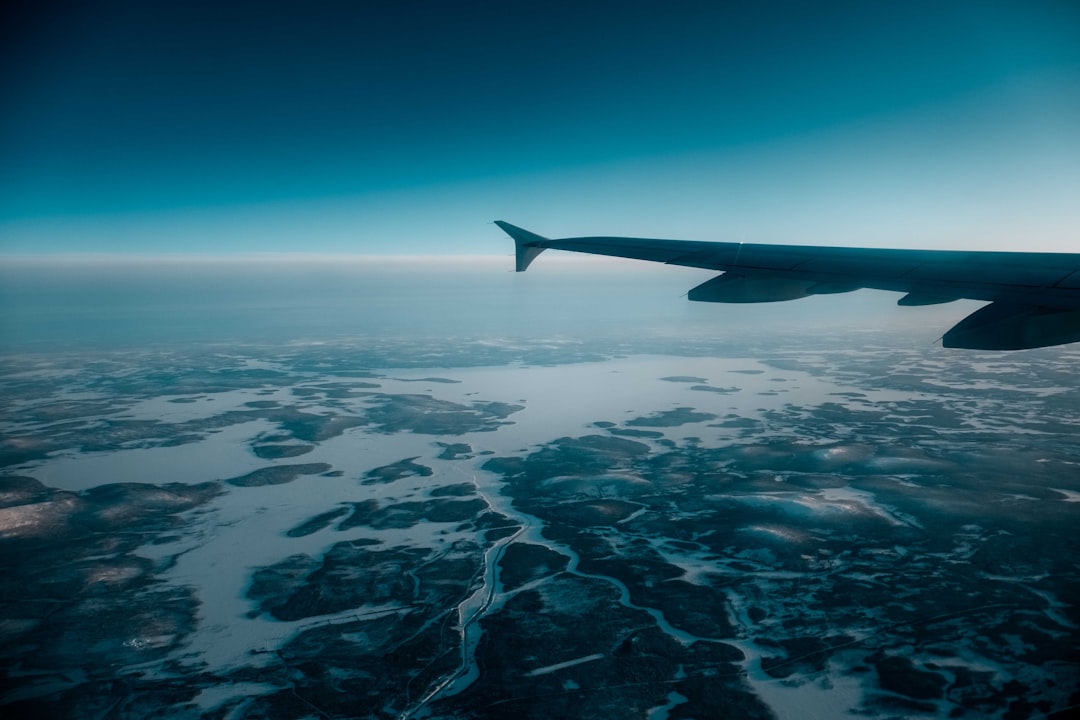 airplane wing over the clouds during daytime