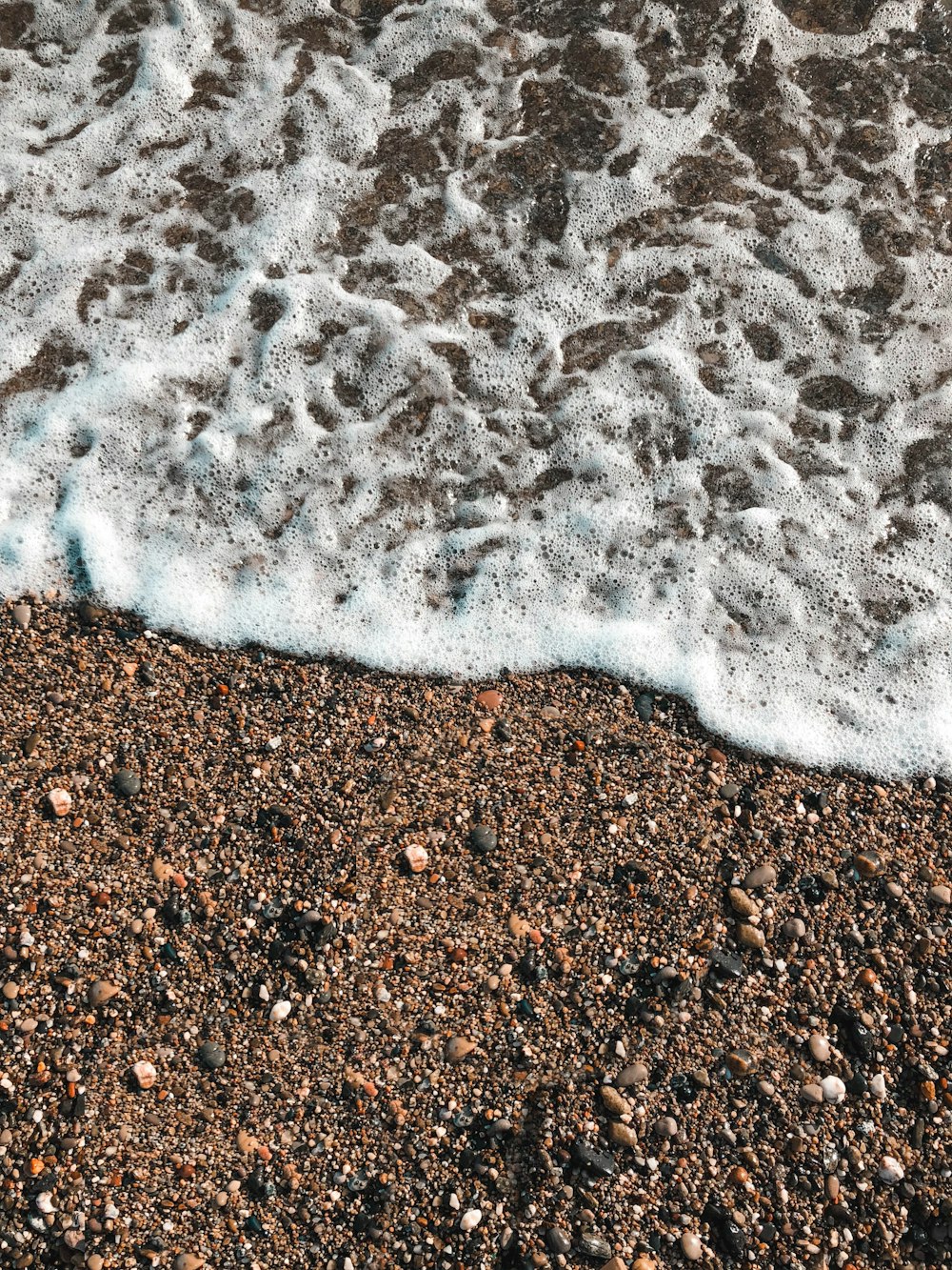 white and brown sand on brown sand