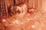 clear glass ball decors on brown wooden table