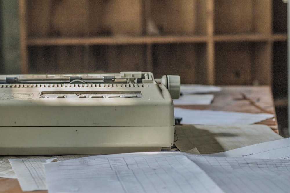 white braille machine on brown wooden table