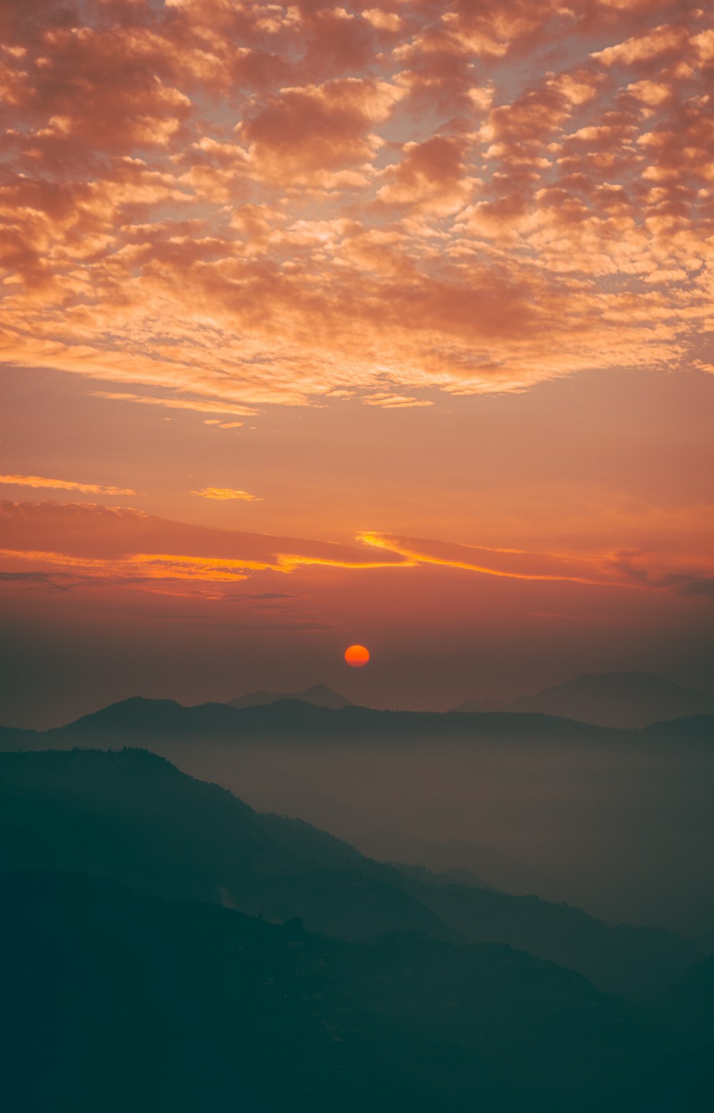 silhouette of mountains during sunset