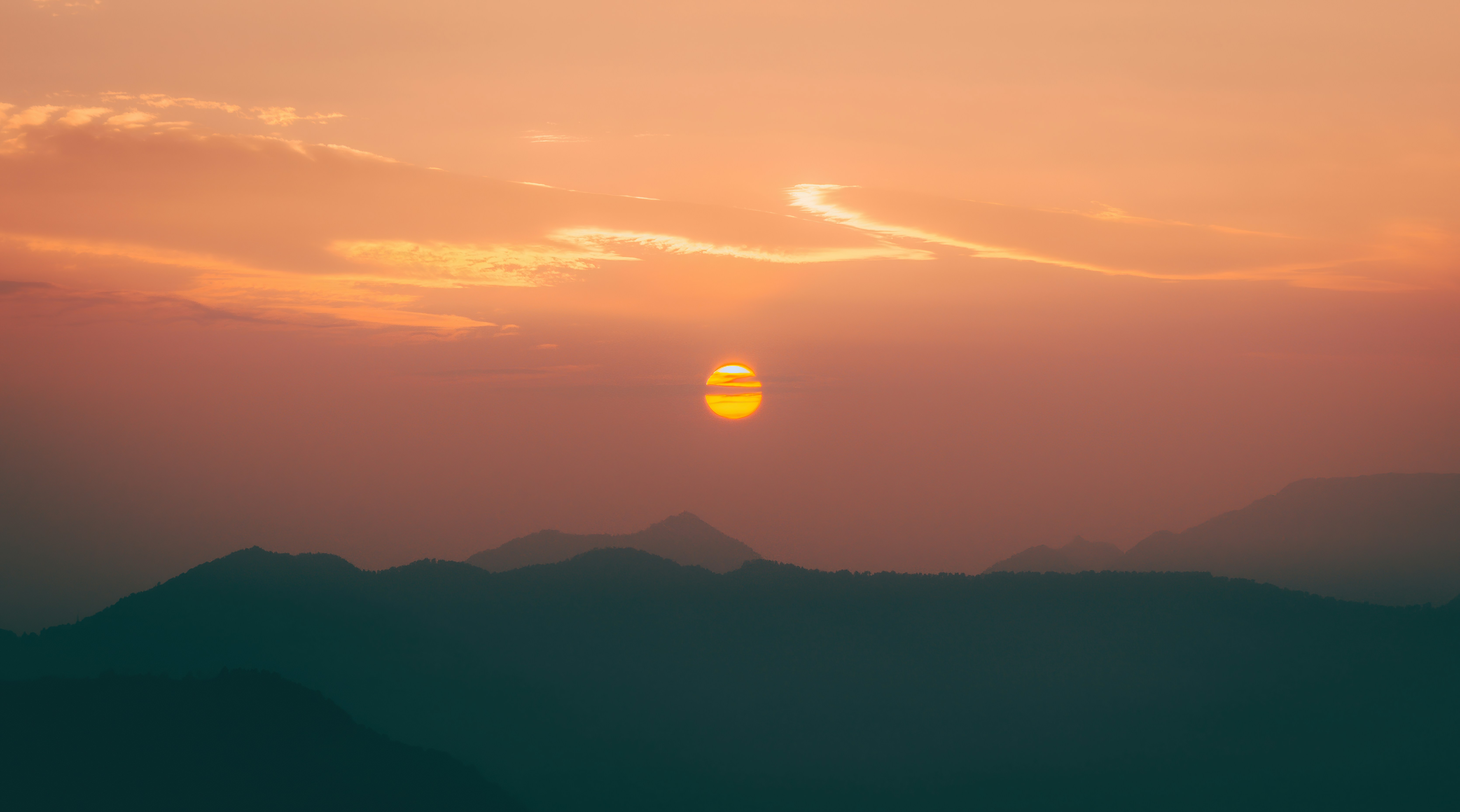 silhouette of mountains during sunset