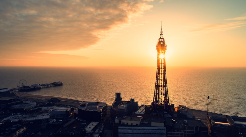 eiffel tower near body of water during sunset