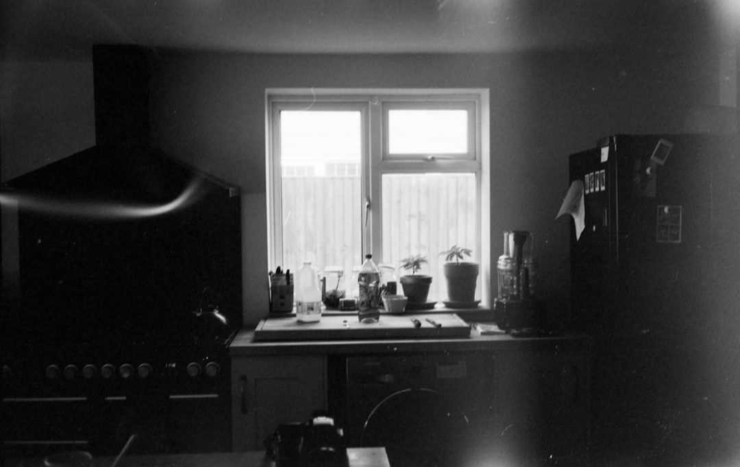 grayscale photo of kitchen sink
