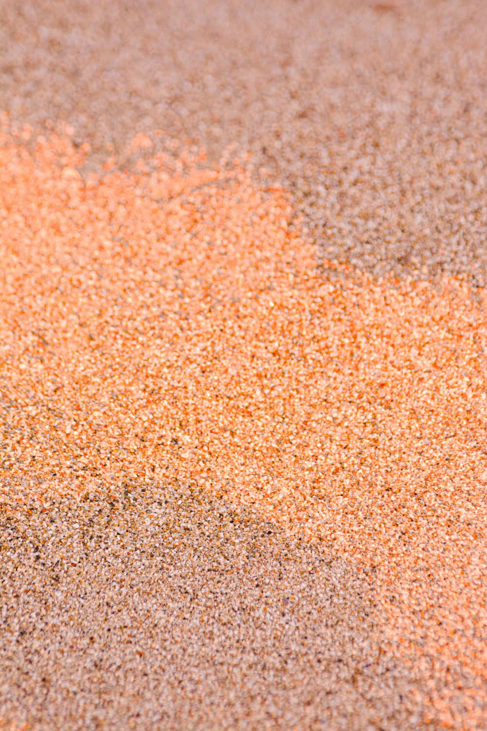 brown and black sand during daytime