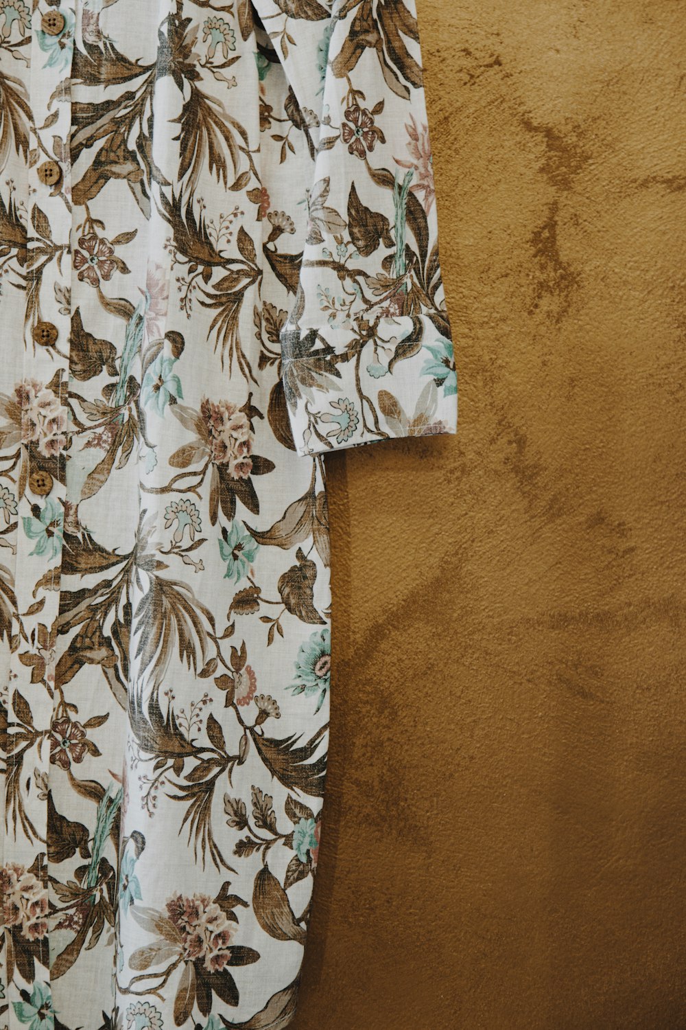 white black and brown floral shirt