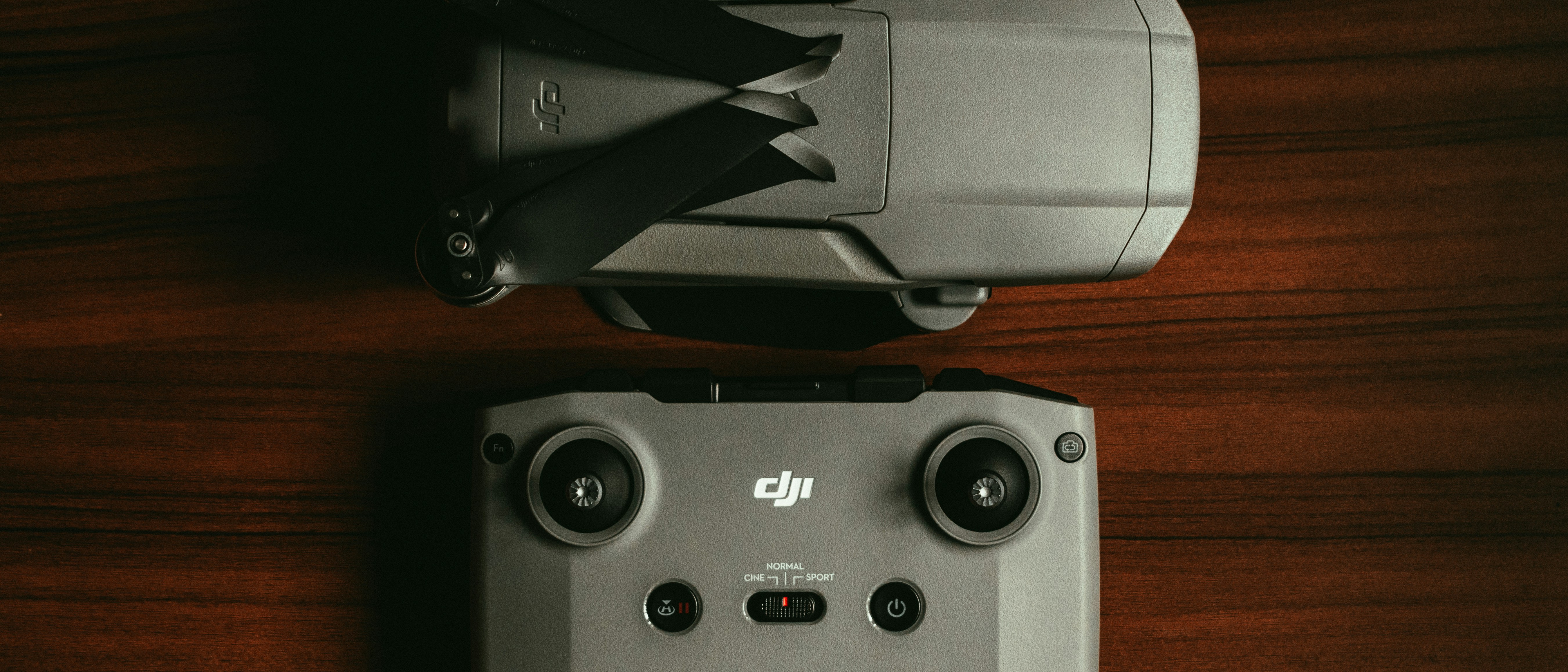 black and gray speaker on brown wooden table