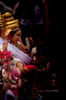 A vibrant custom murti crafted with intricate details and bright colors.