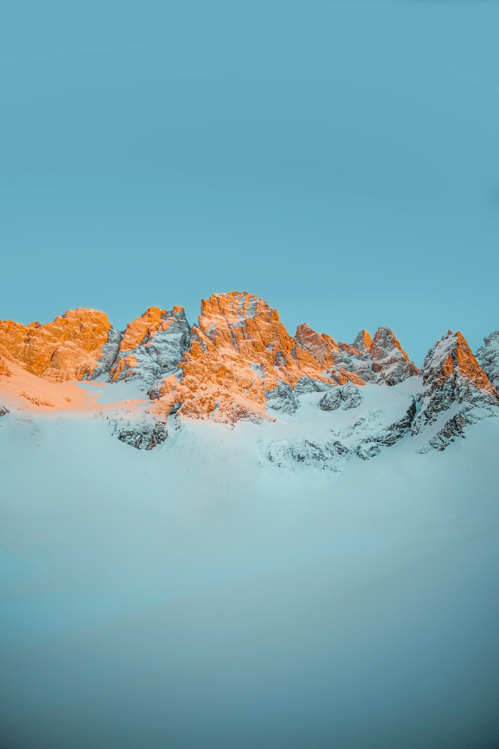 snow covered mountain during daytime