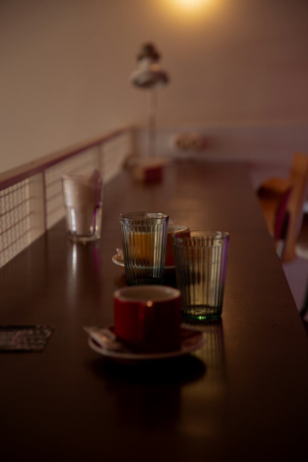 clear drinking glass on brown wooden table