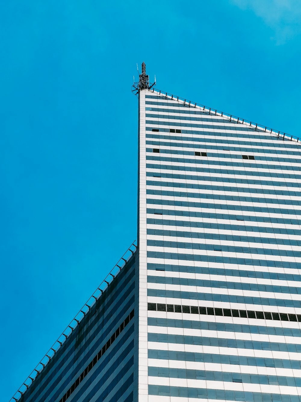 white and black concrete building under blue sky during daytime