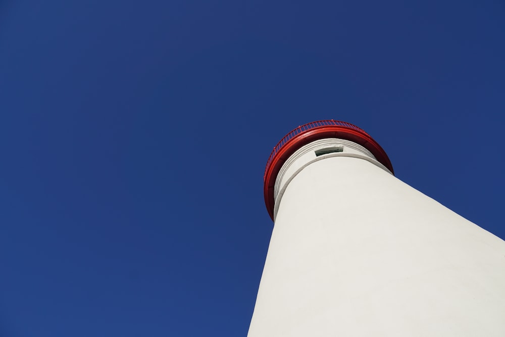 white and red concrete tower under blue sky during daytime