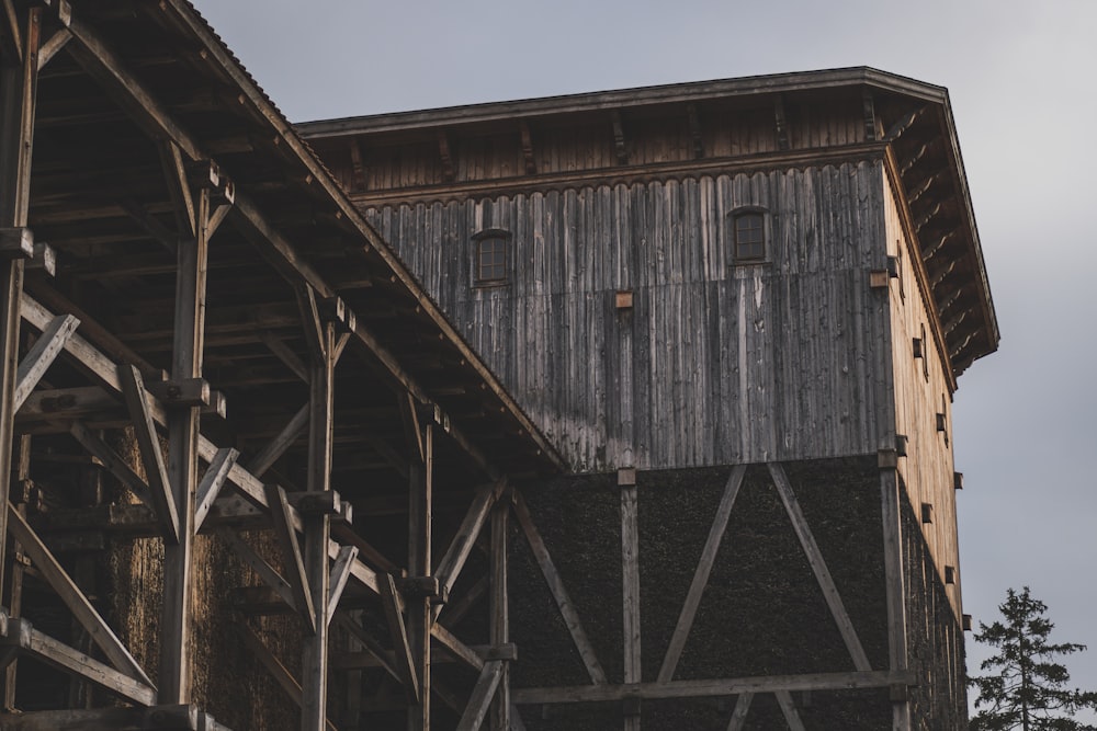 brown wooden house under gray sky