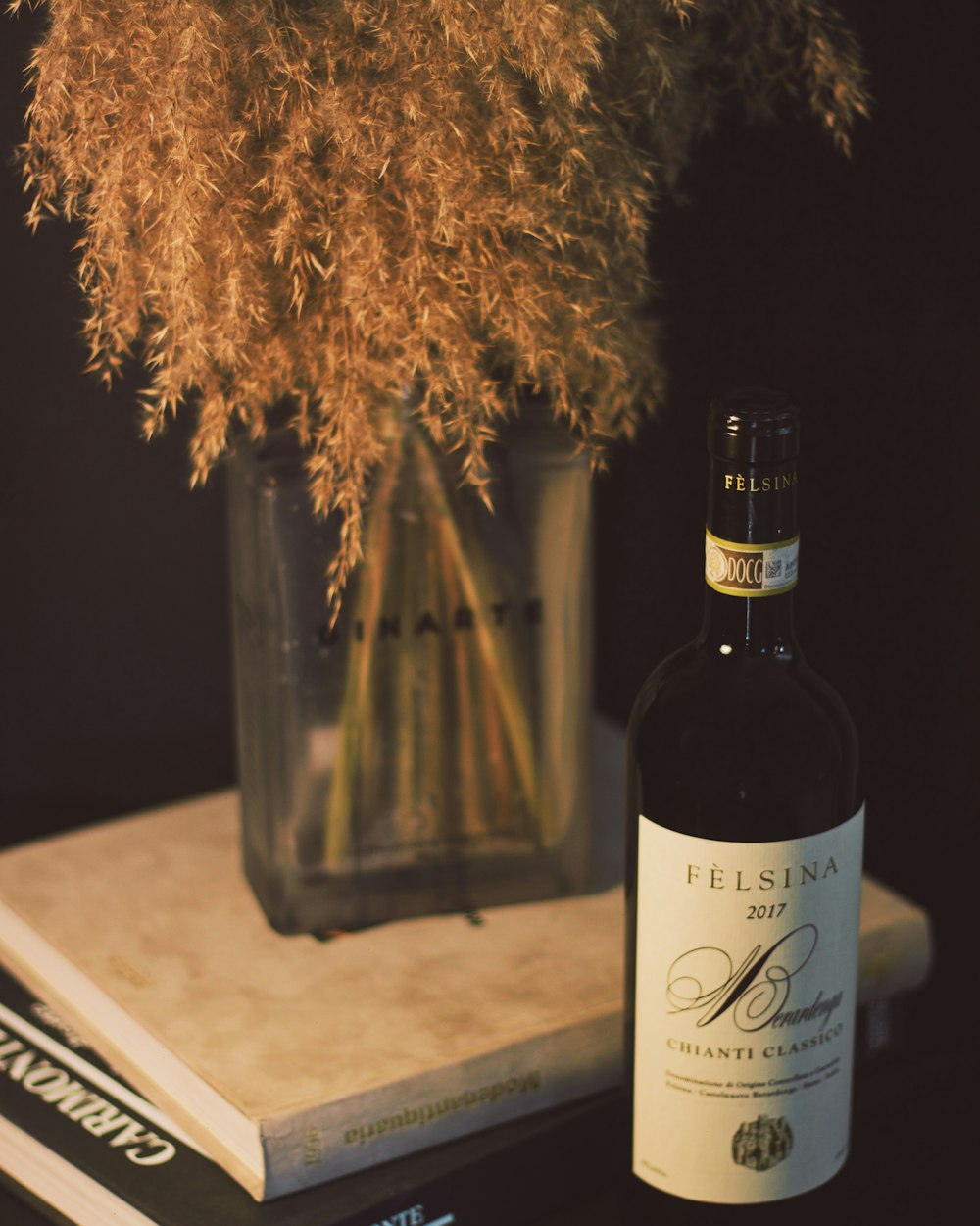 black glass bottle on white table