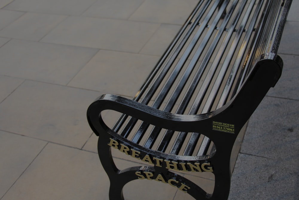 black wooden armchair on white ceramic tiles