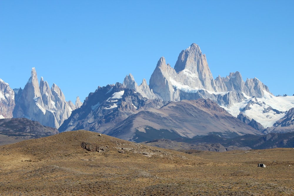 brown and white mountains under blue sky during daytime