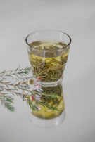 clear drinking glass with yellow liquid
