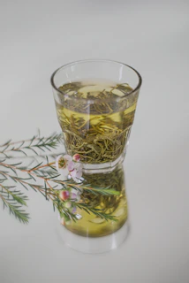 clear drinking glass with yellow liquid