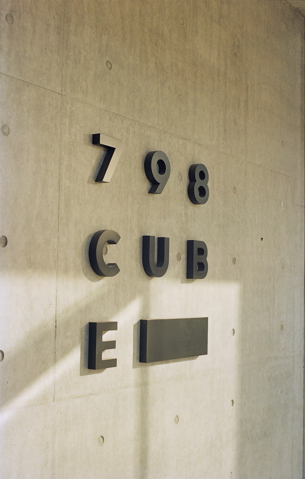 a white wall with numbers and letters on it