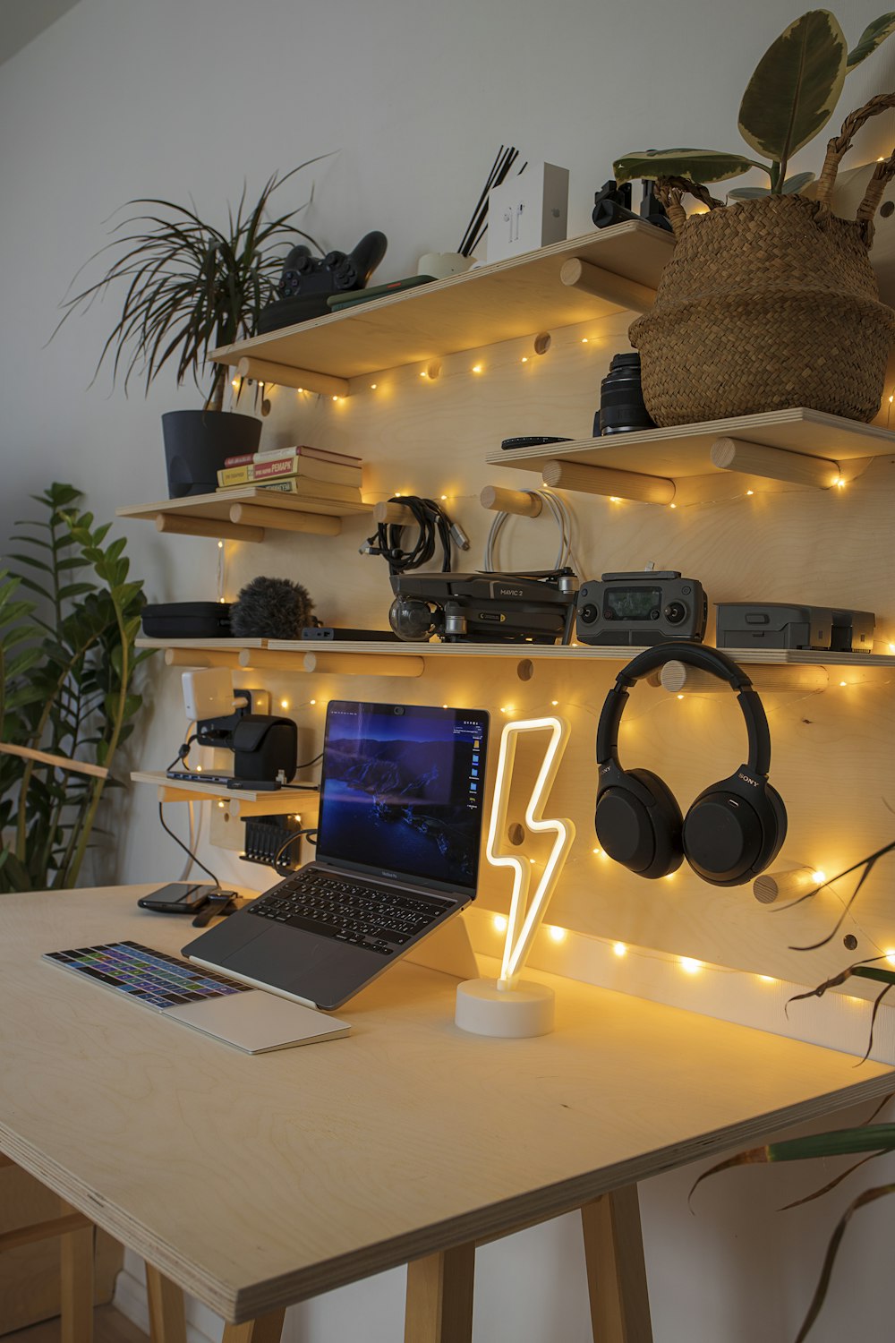 black and gray laptop computer beside black headphones