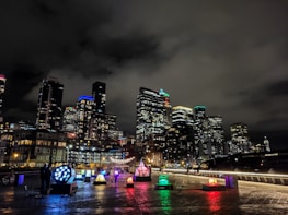 Vibrant cityscape at dusk with Vibetech products in use by diverse people.