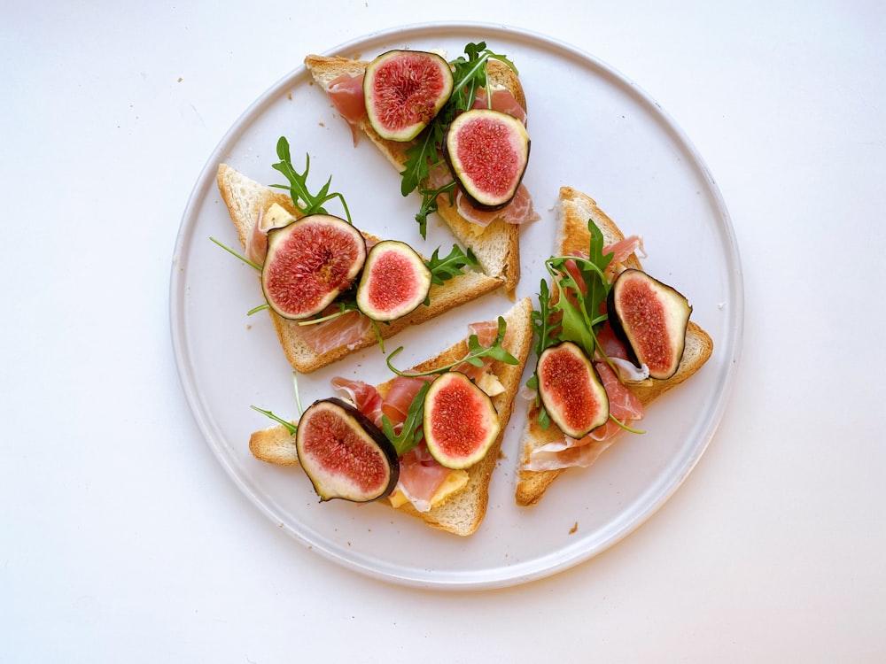 sliced fruit on white ceramic plate