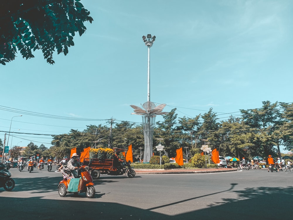 people riding motorcycle on road during daytime