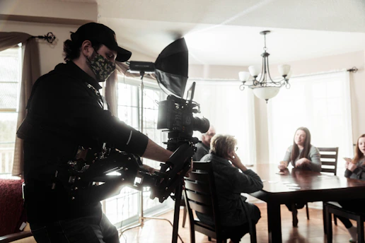 woman in black long sleeve shirt standing in front of camera