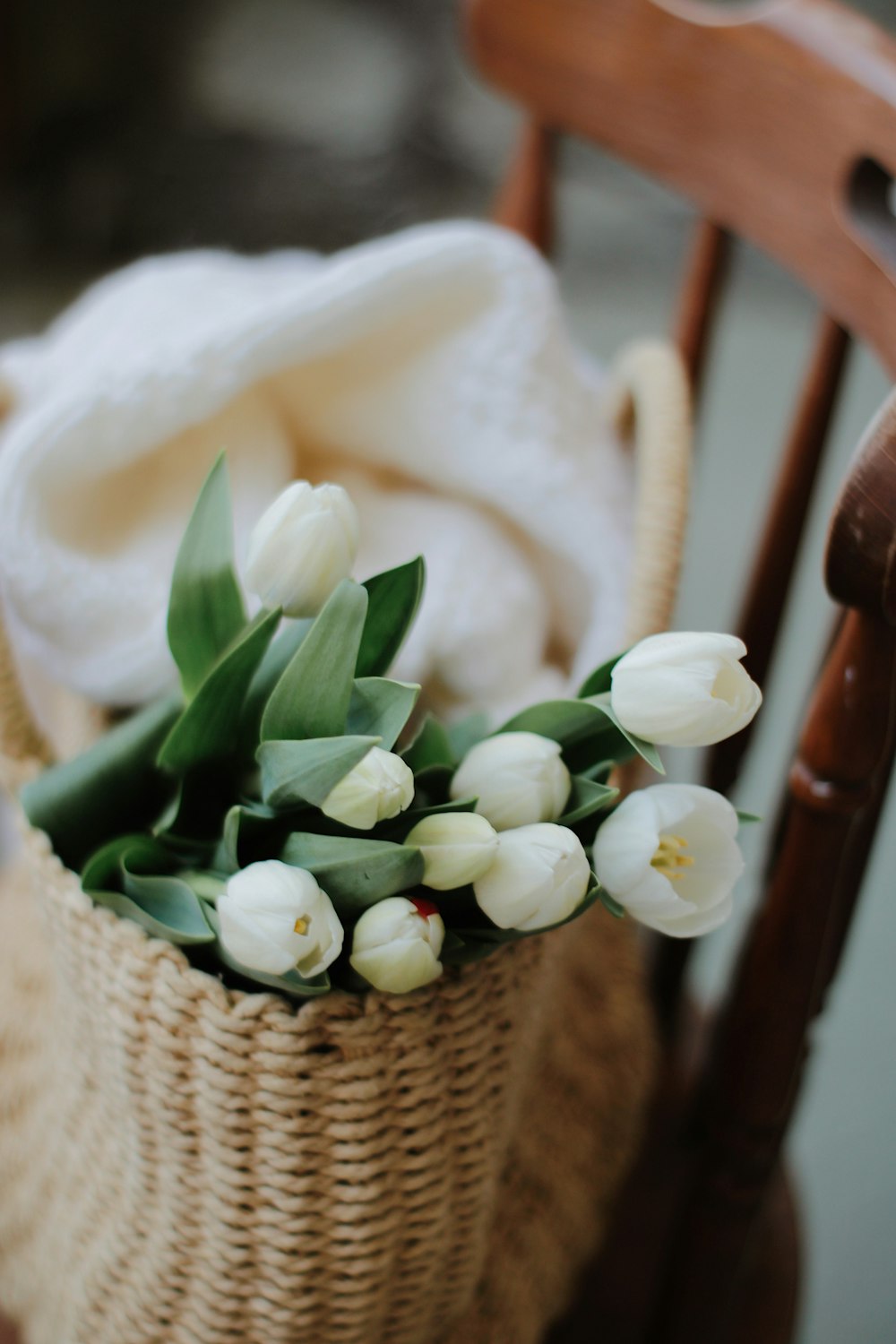 white flowers on brown woven basket