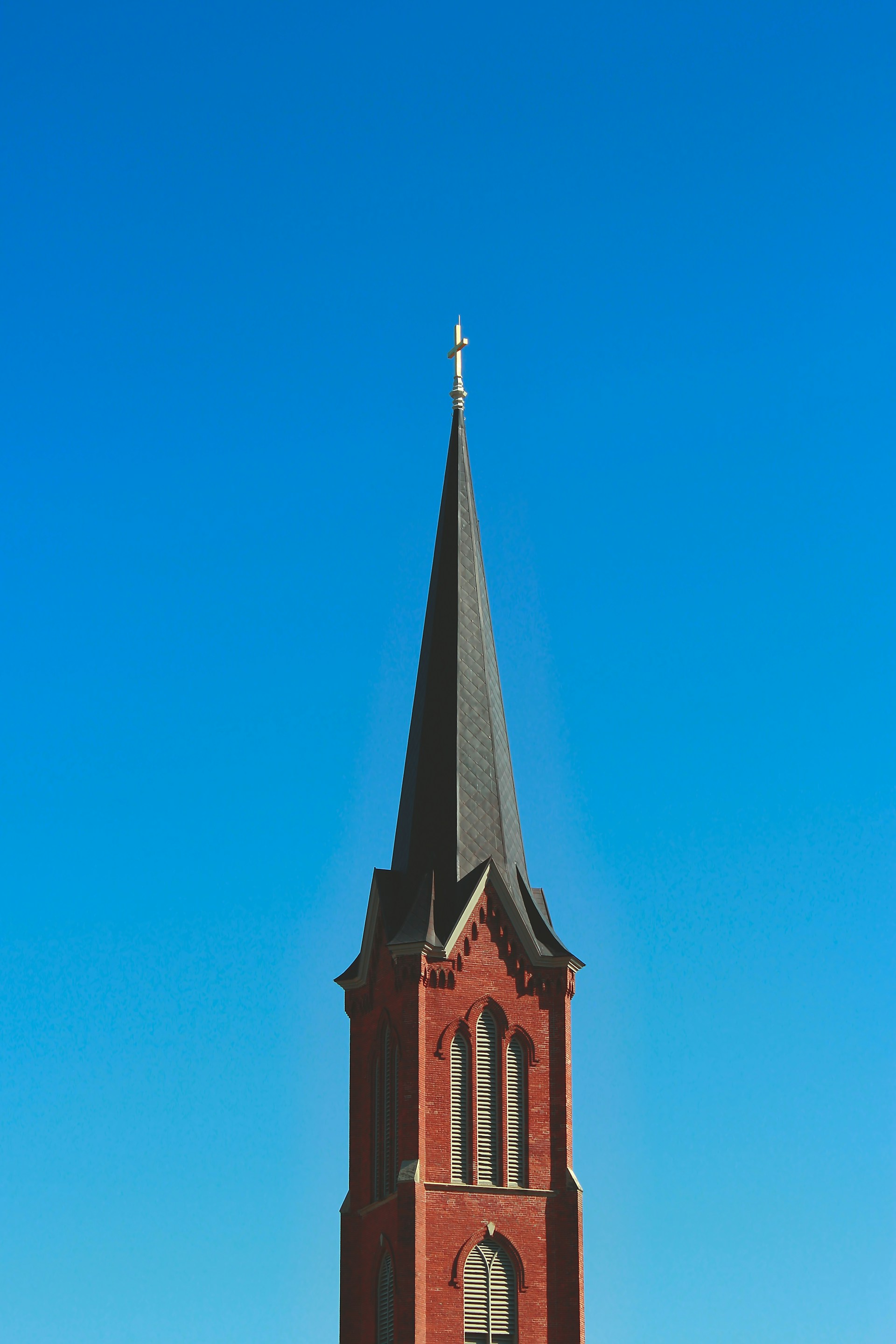 red and black concrete building under blue sky during daytime