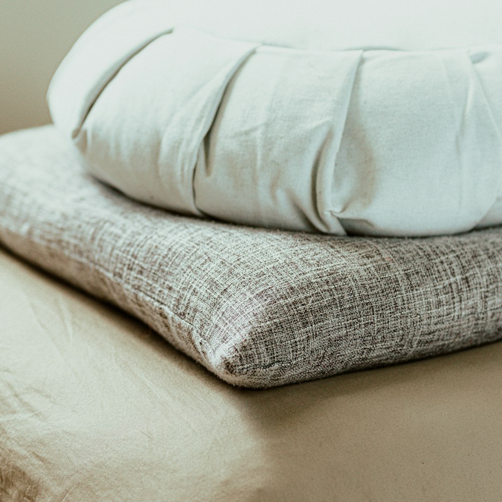 white throw pillow on white couch