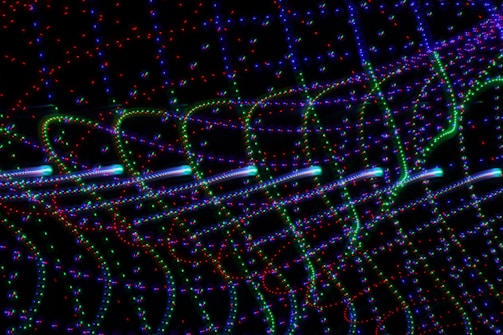 Abstract pattern of colorful light beams representing nanotechnology.