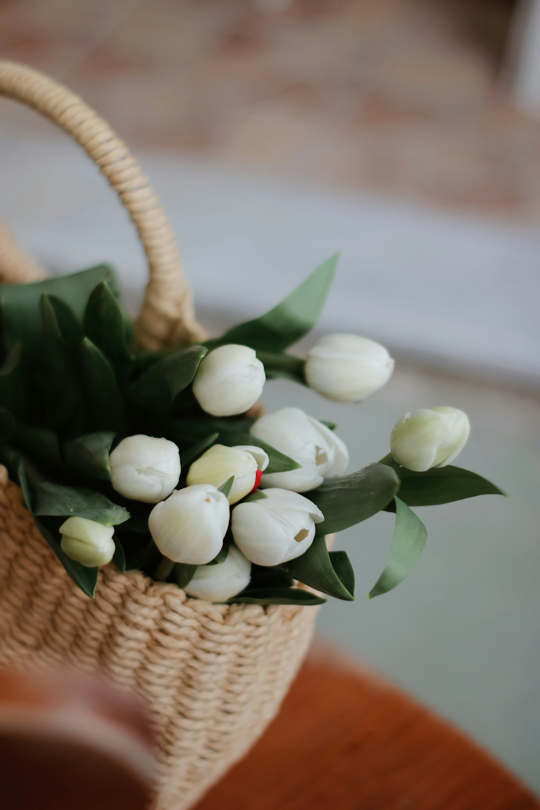 white flowers in brown woven basket