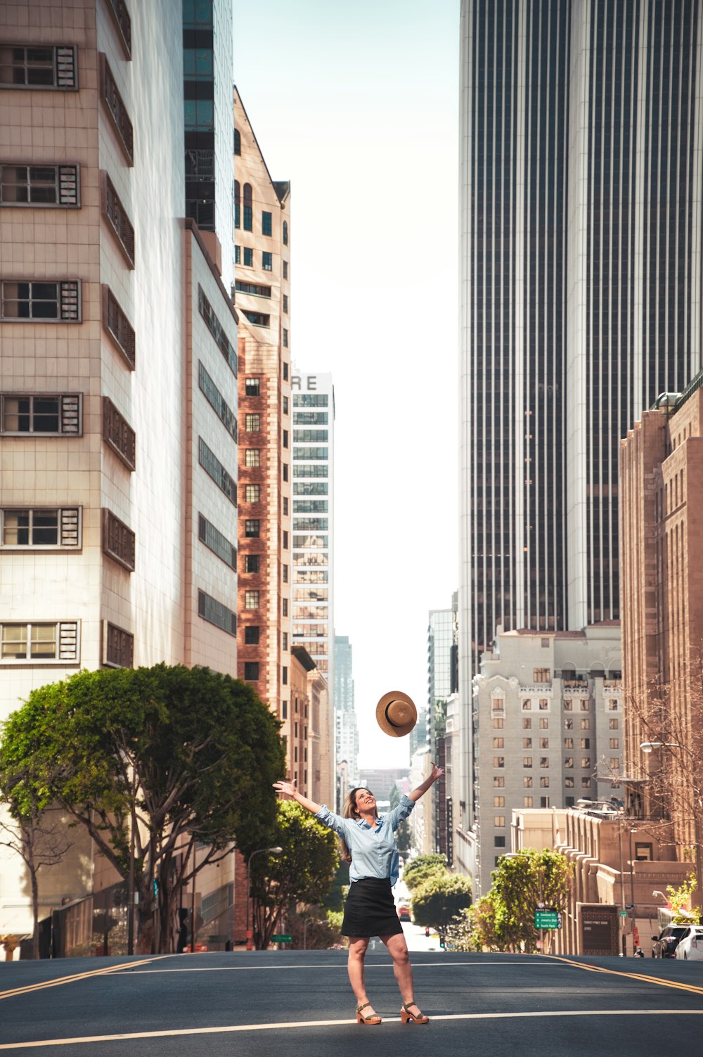 people walking on street near high rise buildings during daytime