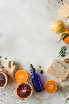 Fresh herbs and citrus fruits on wooden kitchen table
