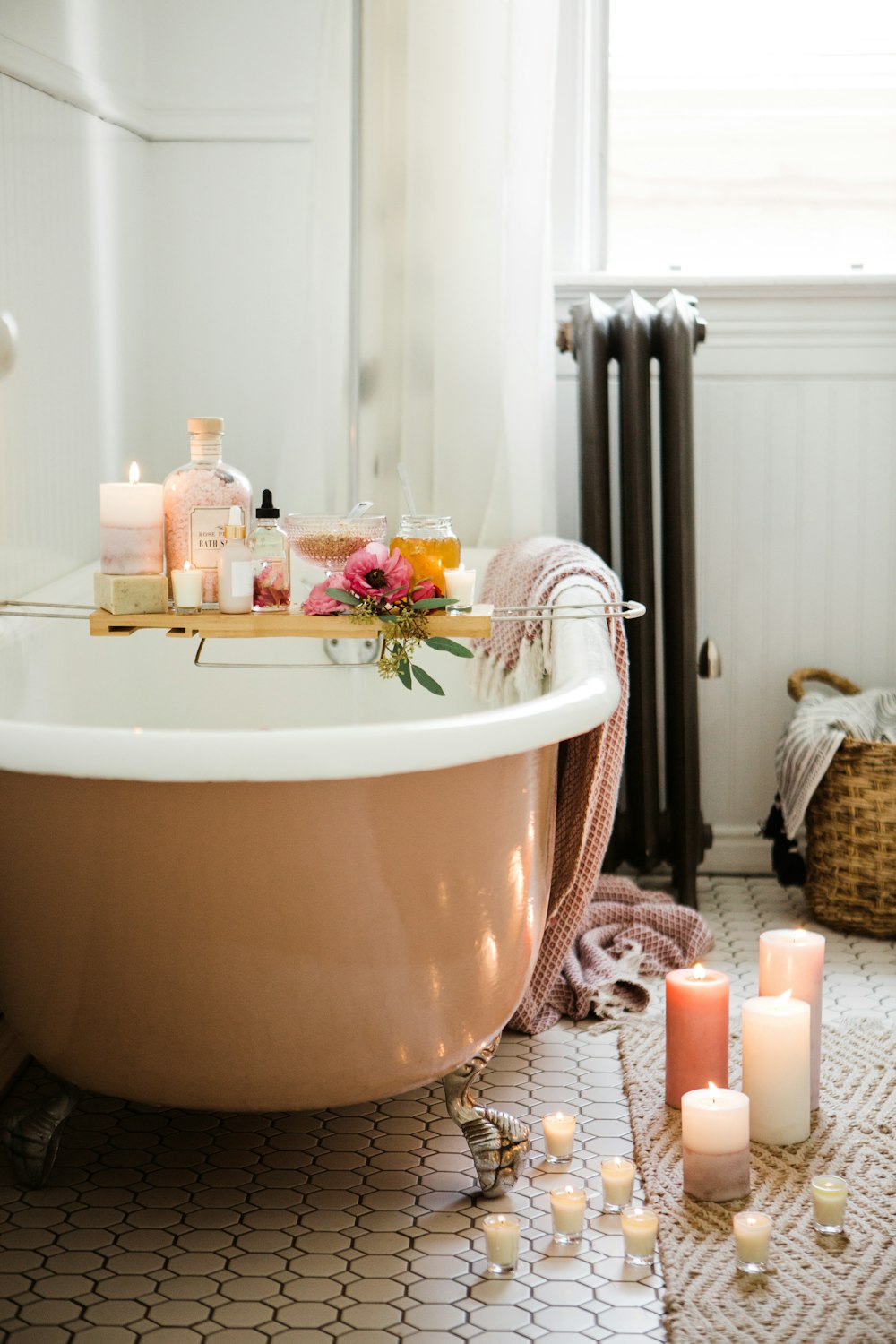 white ceramic bathtub with water