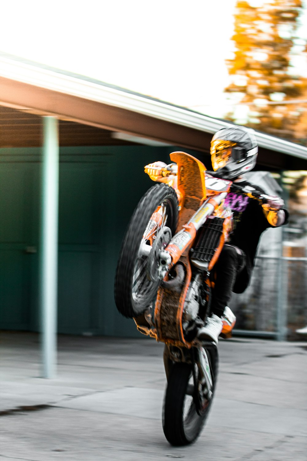 man in yellow shirt riding motorcycle