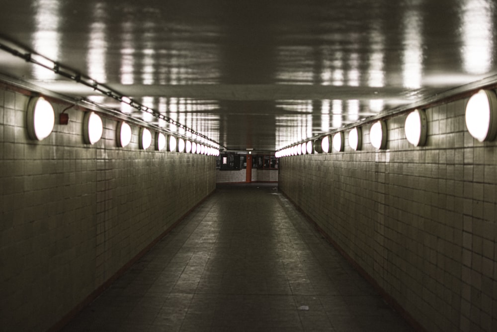 person in black shirt walking on hallway