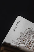 Close-up of the 'Las Meninas' card showcasing linen texture and gold foil edges.