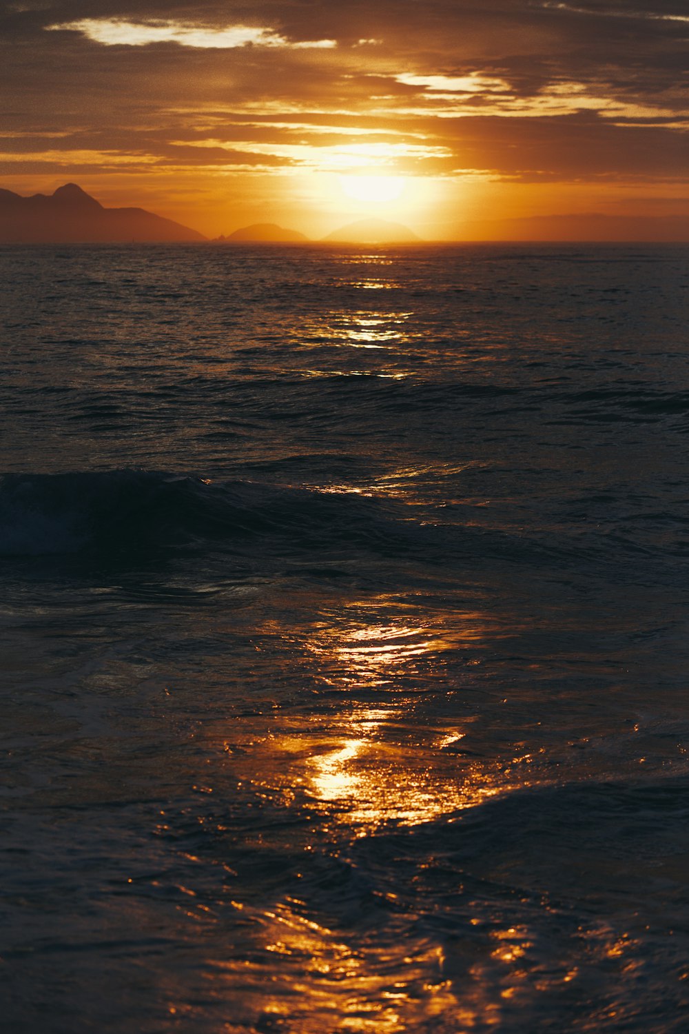 body of water during sunset