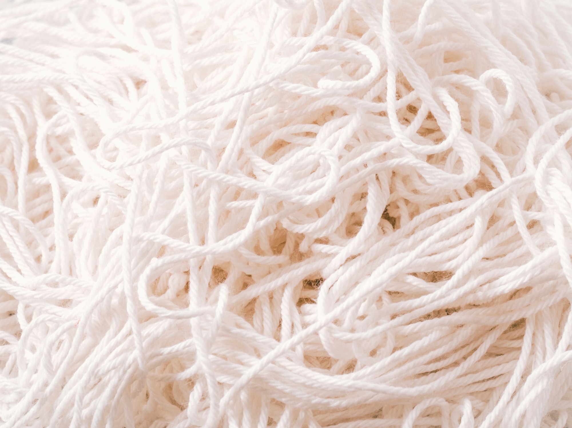 Abstract view of tangled white yarn.