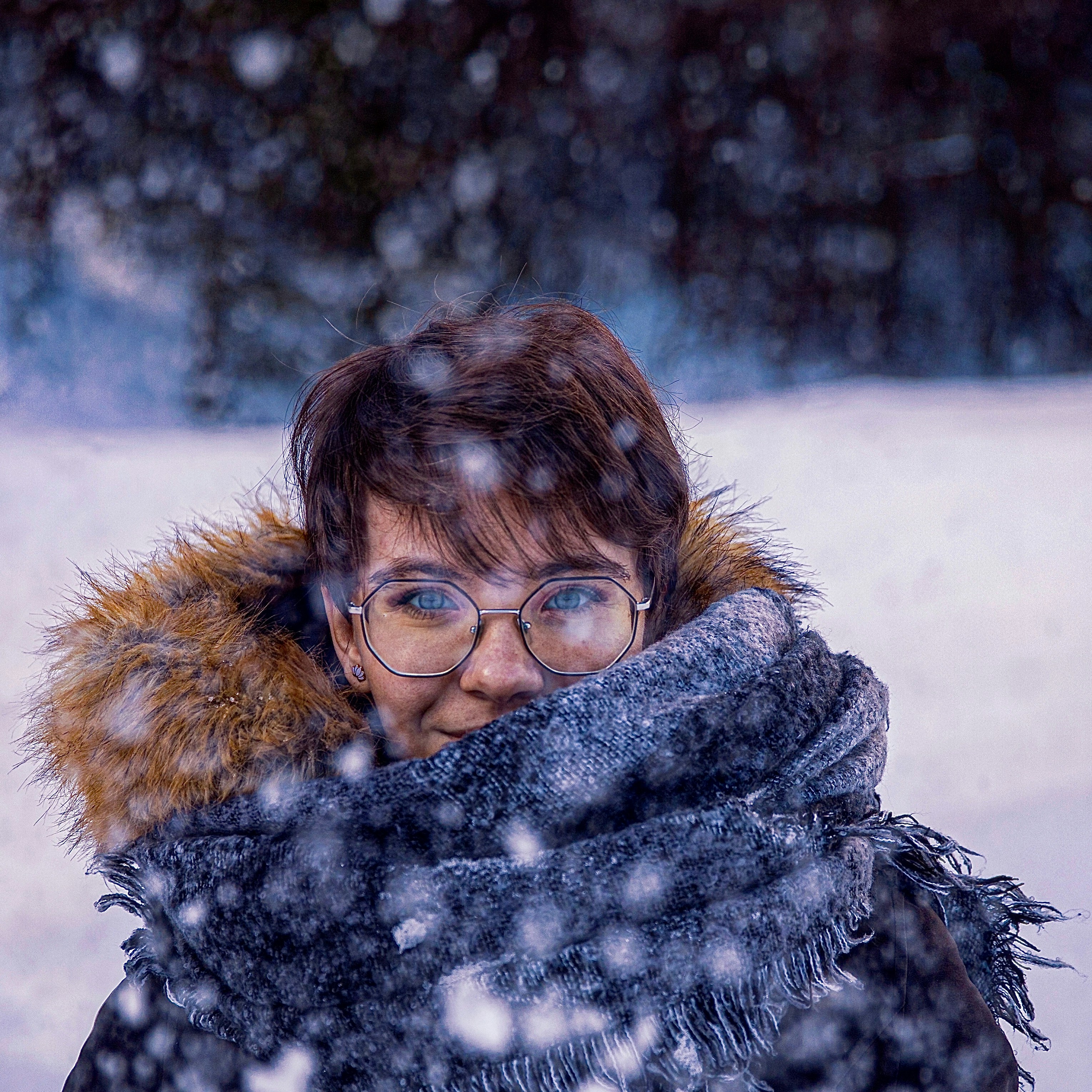 woman in black framed eyeglasses and black scarf