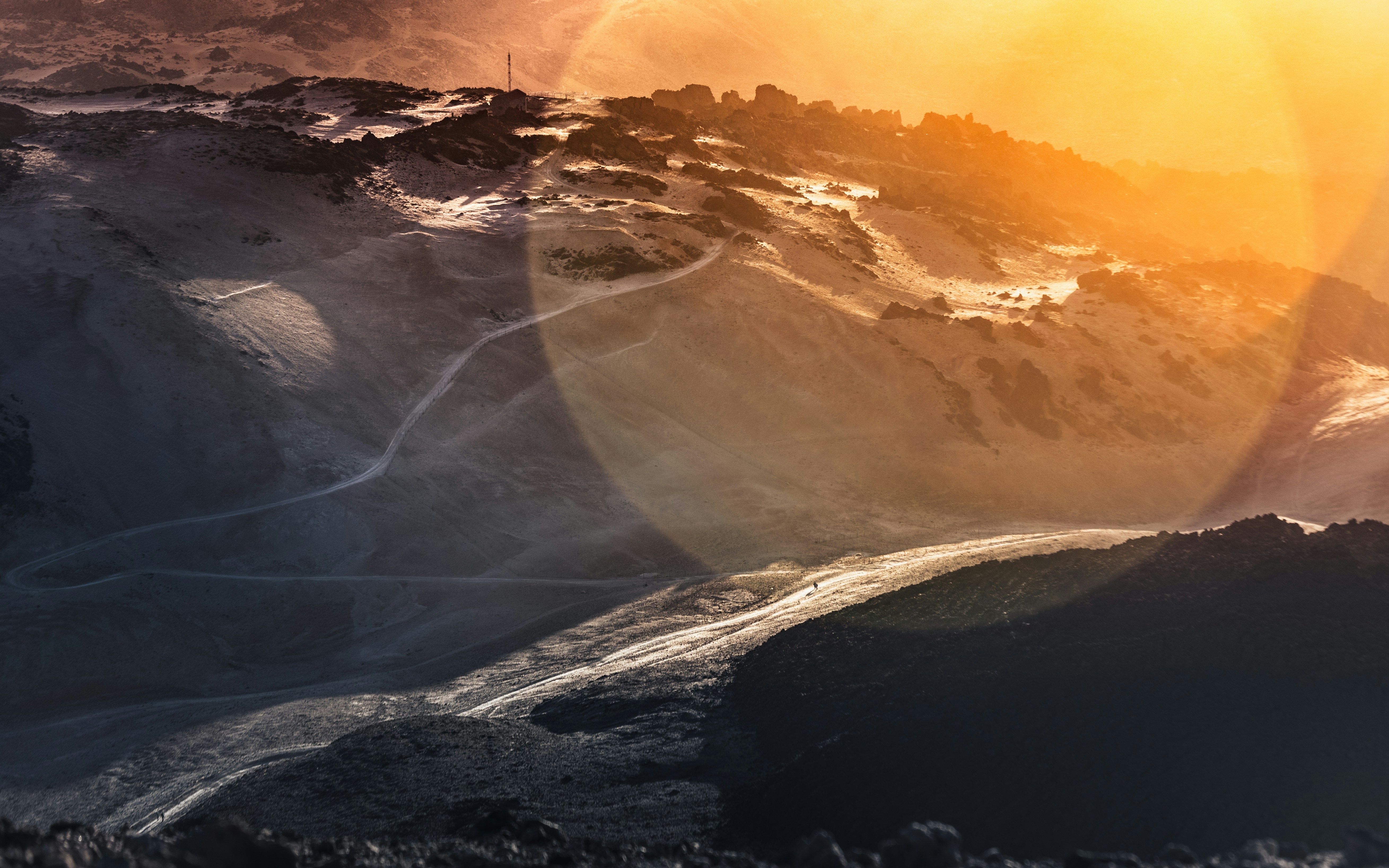 Hiking with the sun. Volcanic scenario on Tenerife island.