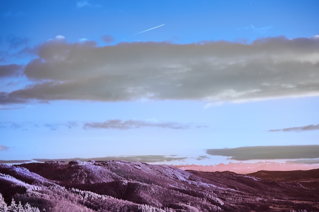 brown and green mountains under blue sky during daytime