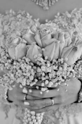 white roses on brown wooden round table