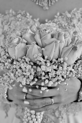 white roses on brown wooden round table
