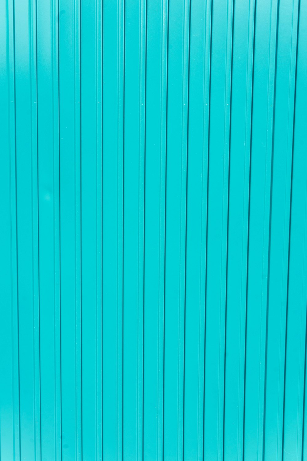 teal and white striped textile