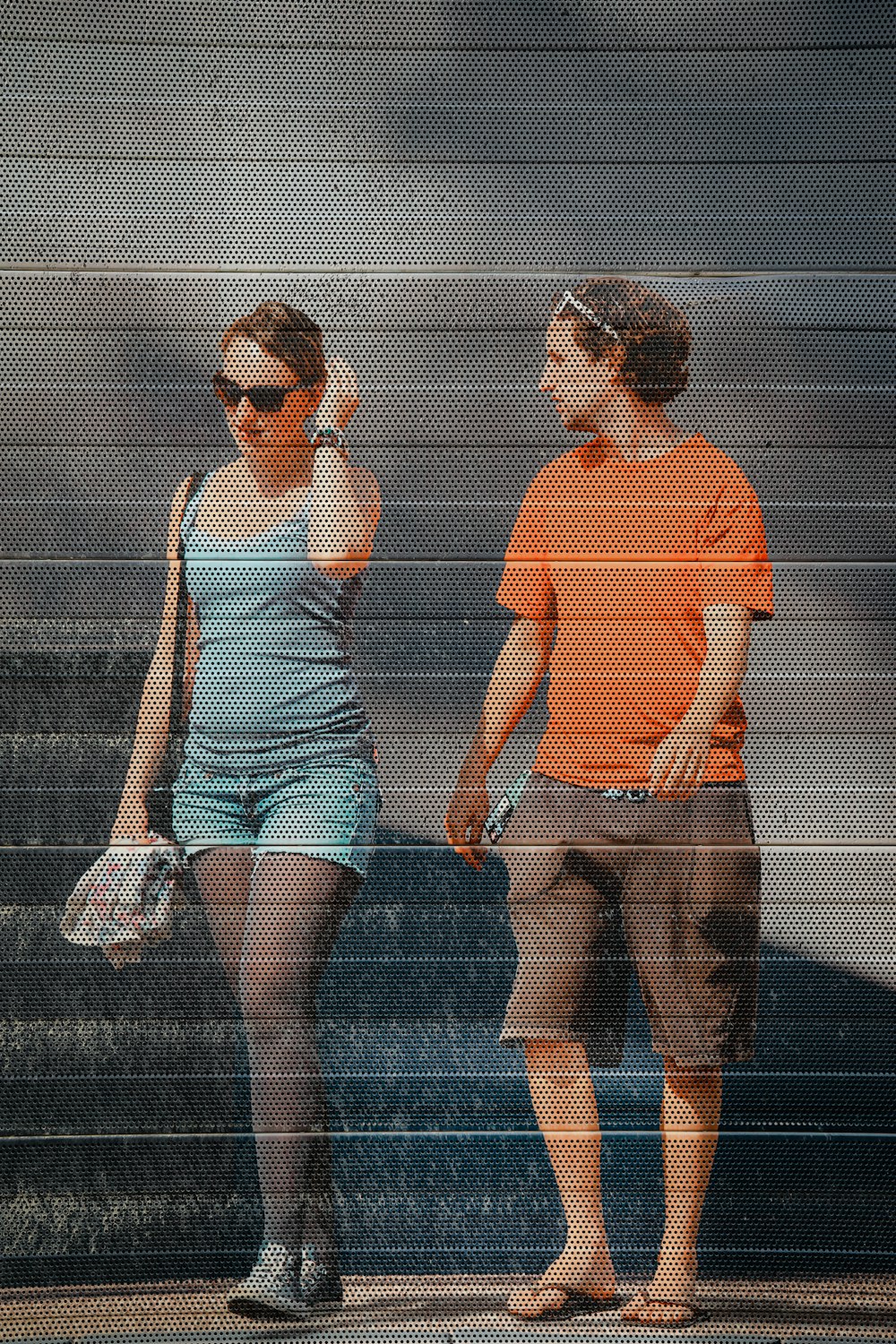 woman in white tank top and white shorts standing on gray pavement